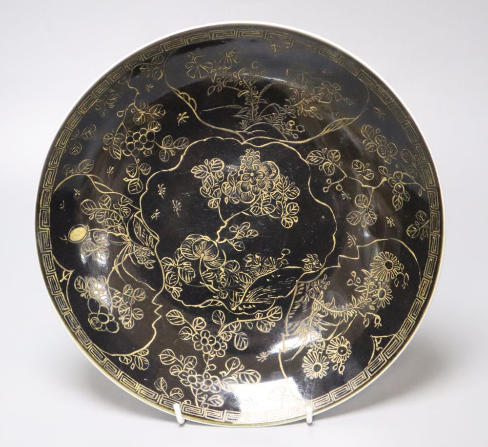 A rare Chinese mirror black glazed circular dish, Kangxi period, diameter 28cm